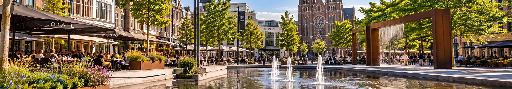 Levendige dag in Tilburg met terrassen, waterpartij en de Heuvelse kerk